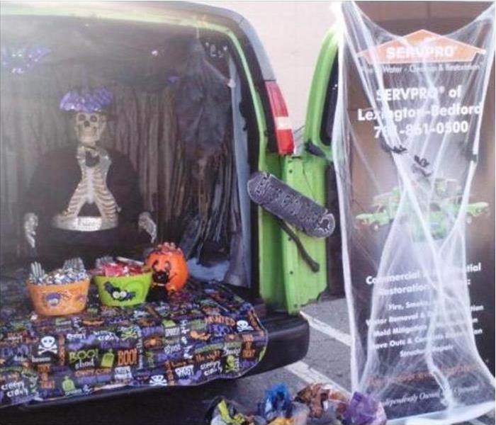 Green SERVPRO Van with Halloween Decorations 
