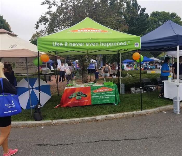 SERVPRO branded tent with branded table underneath